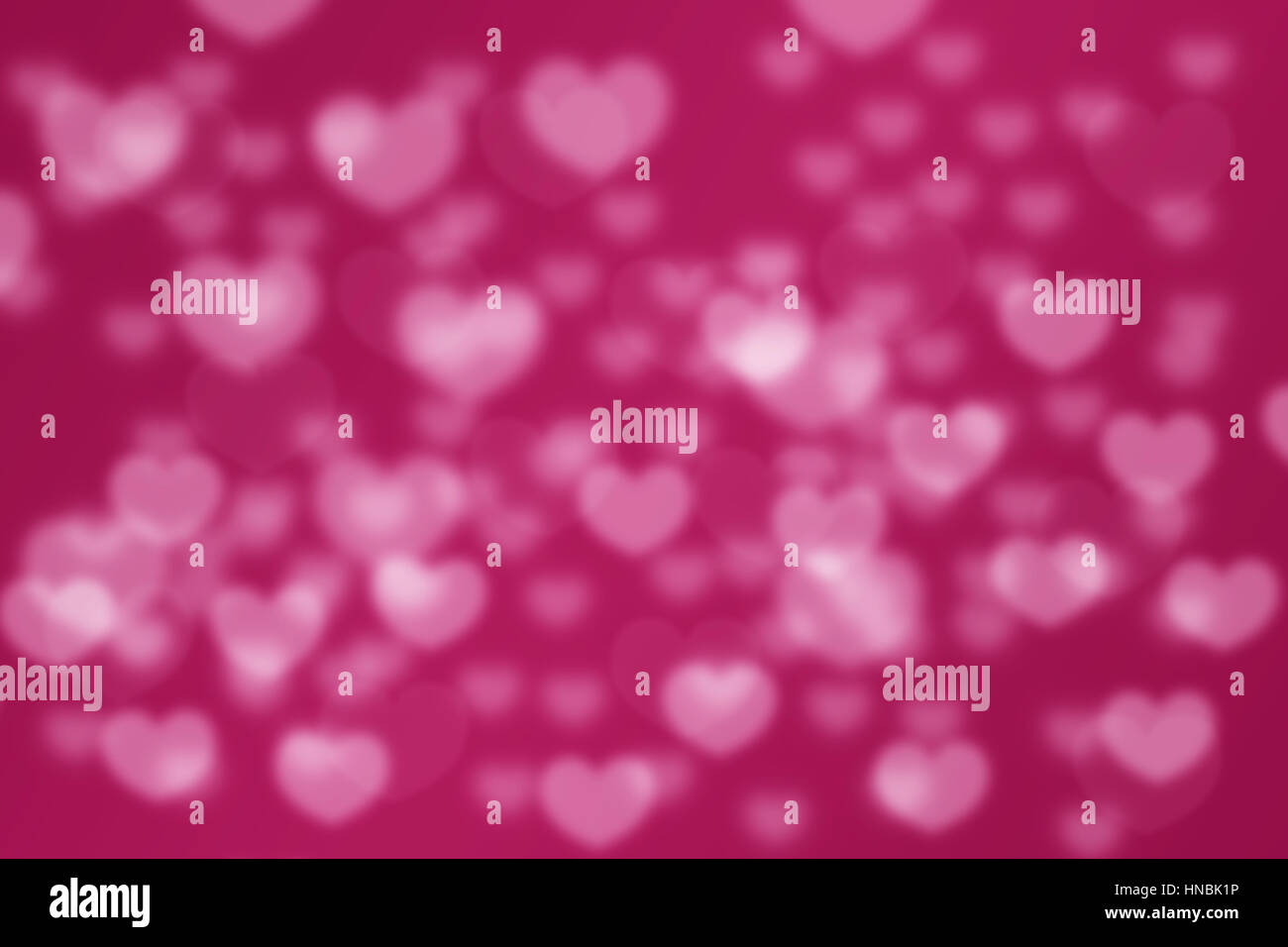 Abstract pink love hearts bokeh blurred background Stock Photo