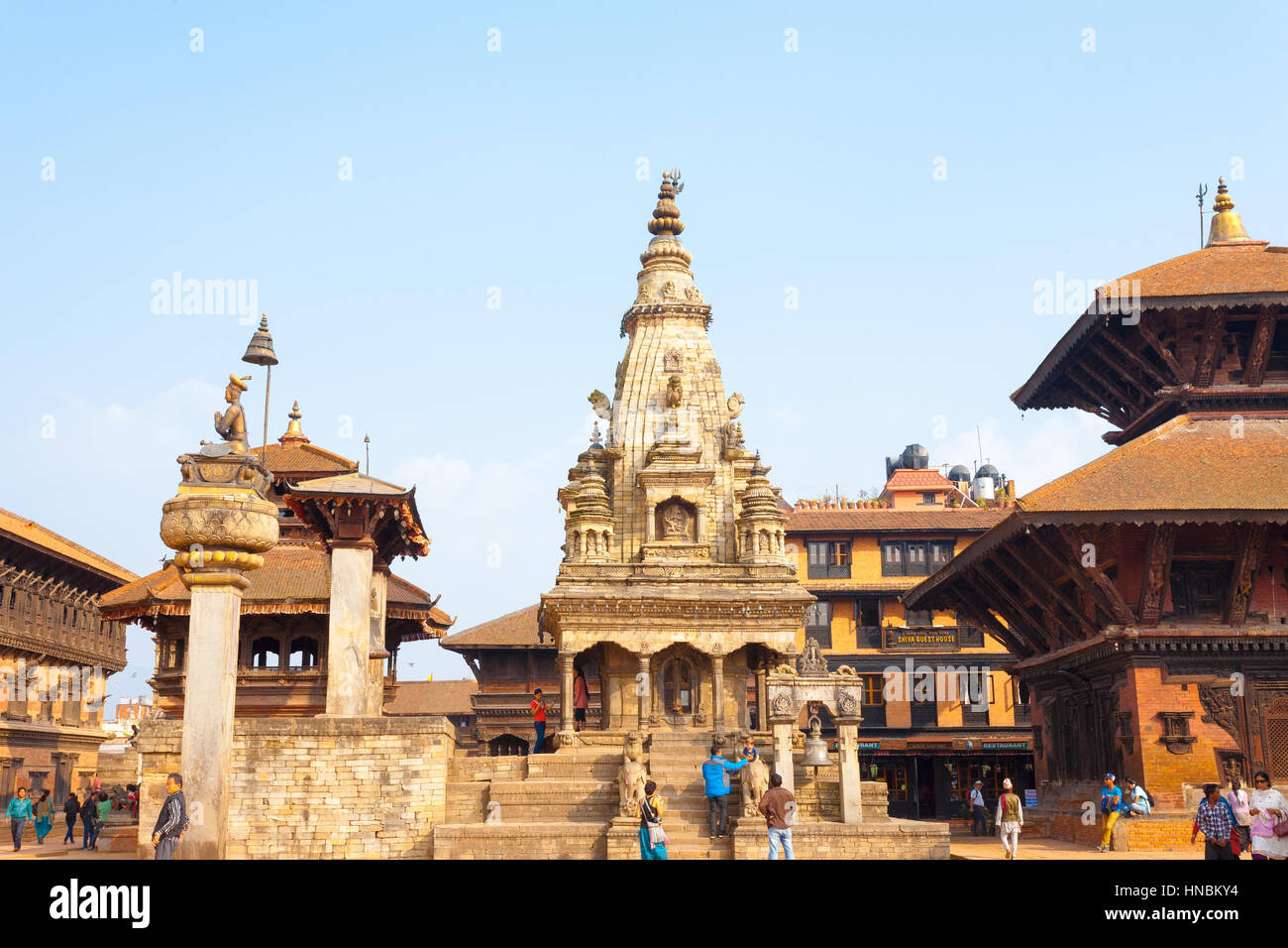 Bhaktapur, Nepal - October 31, 2013: Tourists on front steps of undamaged Vatsala Durga Temple before 2015 Gorkha earthquake damage. Horizontal Stock Photo