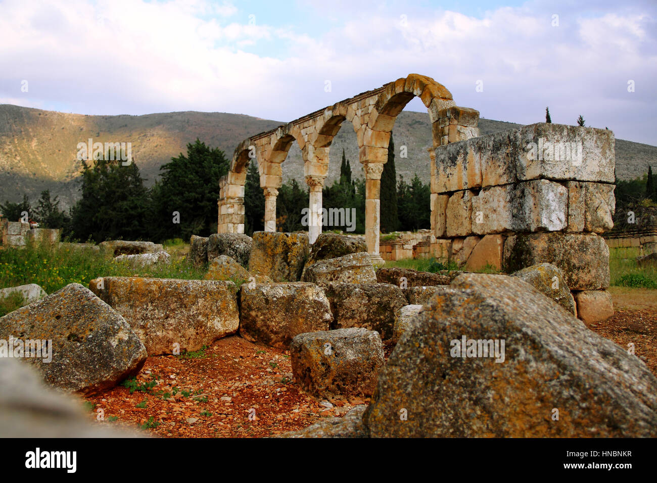Arches and foundation stones mark the crossroads between the main north and south and east asnd west roads in the Omayyad city of Anjar, Lebanon. Stock Photo
