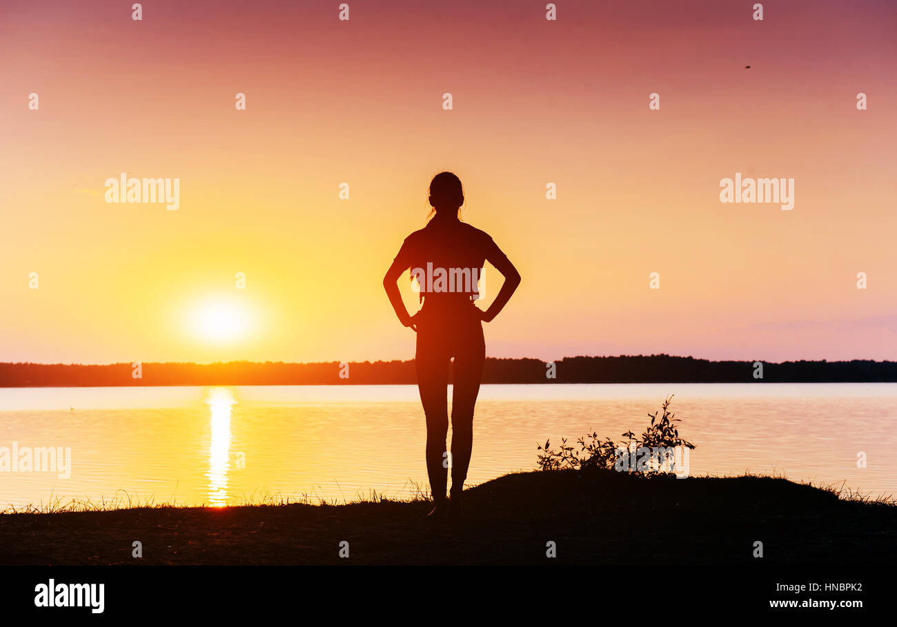 girl at sunset by the lake Stock Photo - Alamy