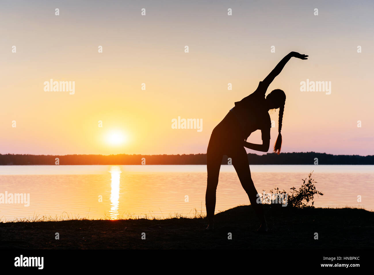 girl at sunset by the lake Stock Photo - Alamy