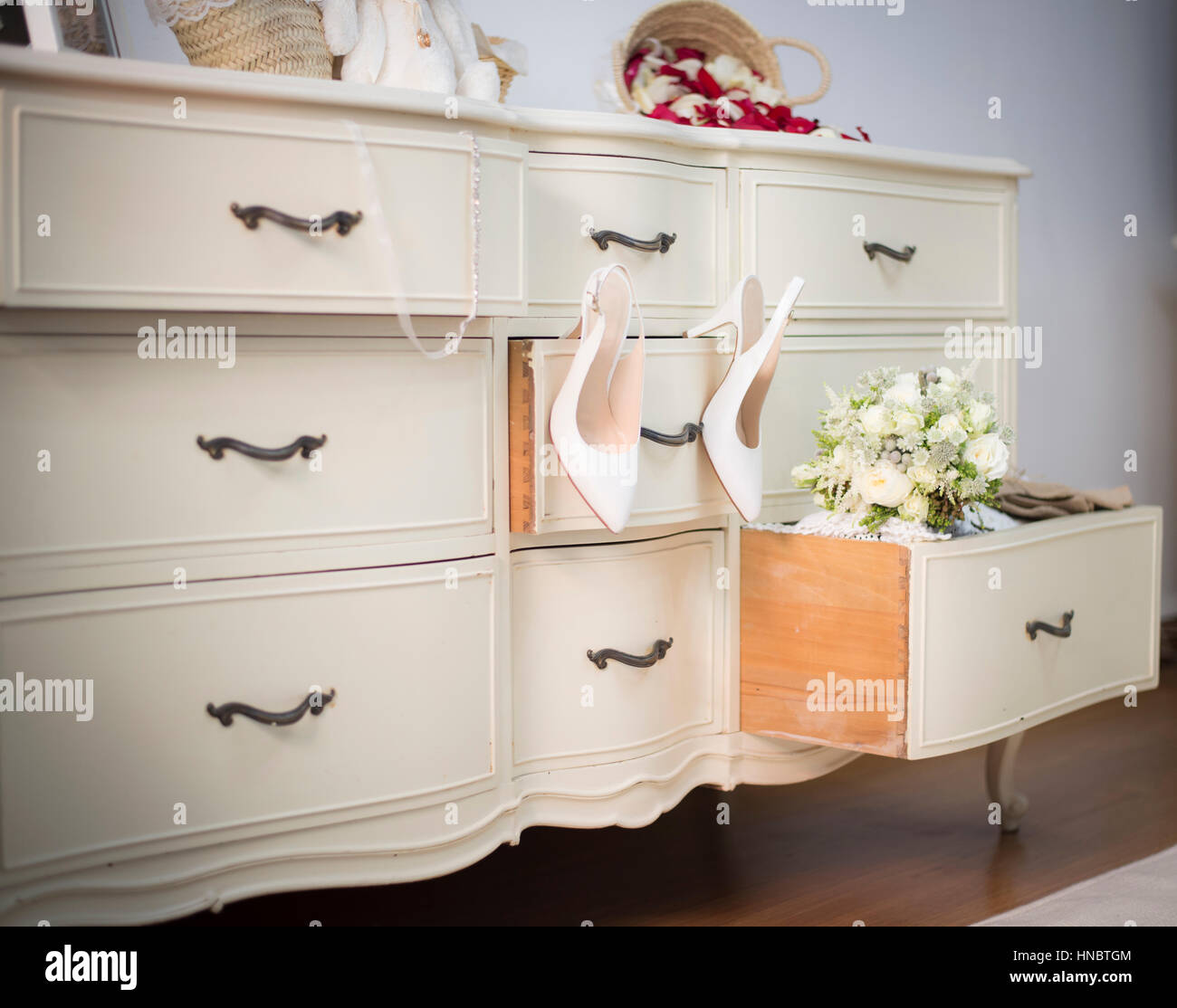 Wedding Shoes And Bouquet On A Dresser Stock Photo 133641108 Alamy