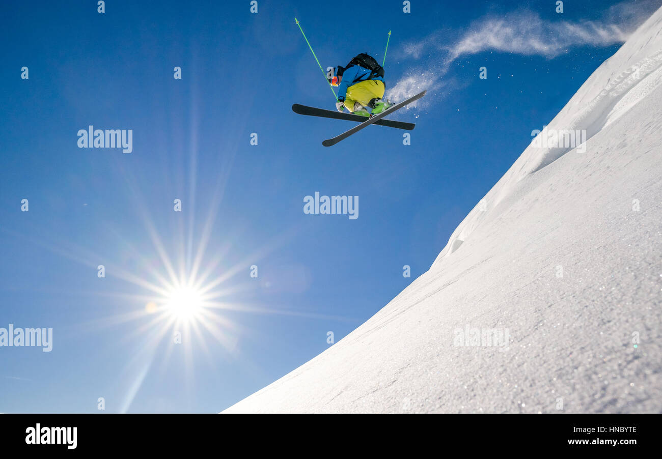 Skier jumping off a snow bank, Spittal an der Drau, Austria Stock Photo