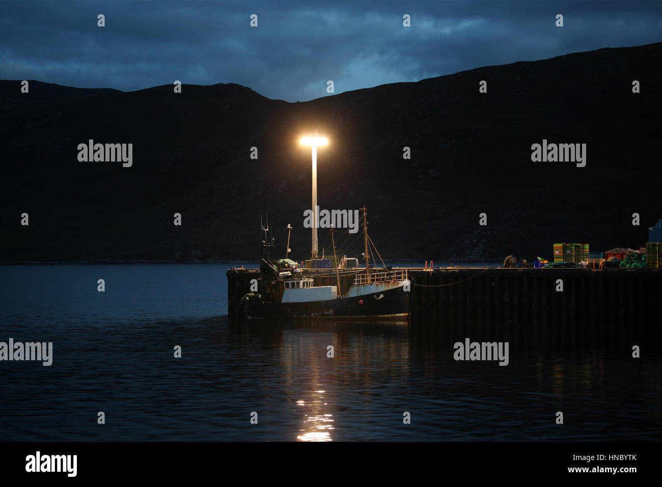 Fishing boat moored at pier, Ullapool, Scotland, United Kingdom Stock Photo