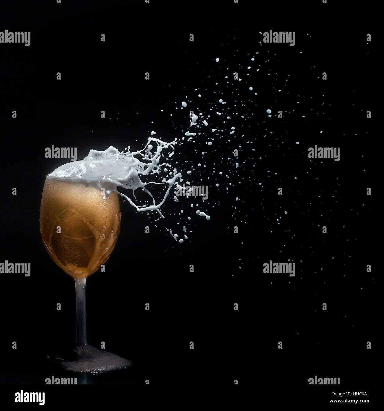 Beer foam blowing off a wine glass Stock Photo Alamy