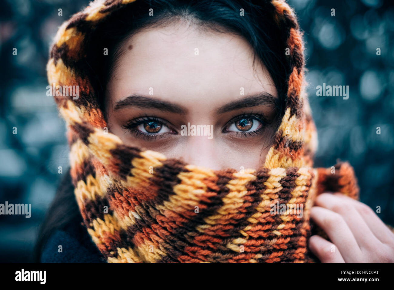 Woman with a scarf wrapped around her head Stock Photo