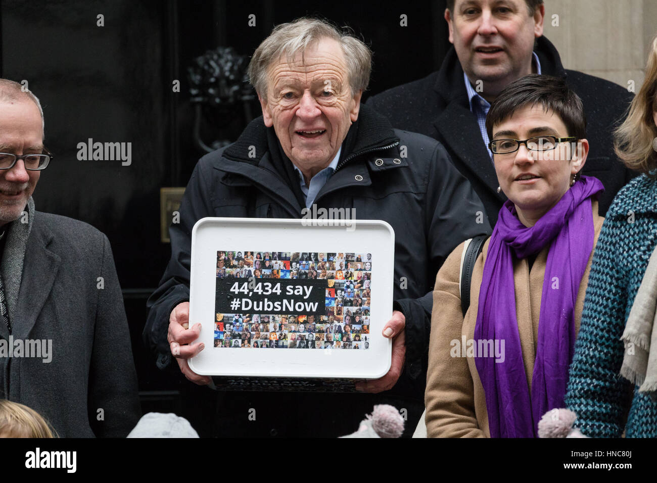 London, UK. 11th Feb 2017. Lord Alf Dubs and supporters, with their children, deliver a 44,435 strong petition to 10 Downing Street, calling on the Prime Minister, Theresa May to reconsider the ending of the Dubs Amendment scheme that allows unaccompanied child refugee migrants a safe passage into the UK. Lord Dubs arrived in the UK himself as a child refugee, along with nearly 10,000 predominantly Jewish children who were fleeing Nazi controlled Europe. Credit: Vickie Flores/Alamy Live News Stock Photo