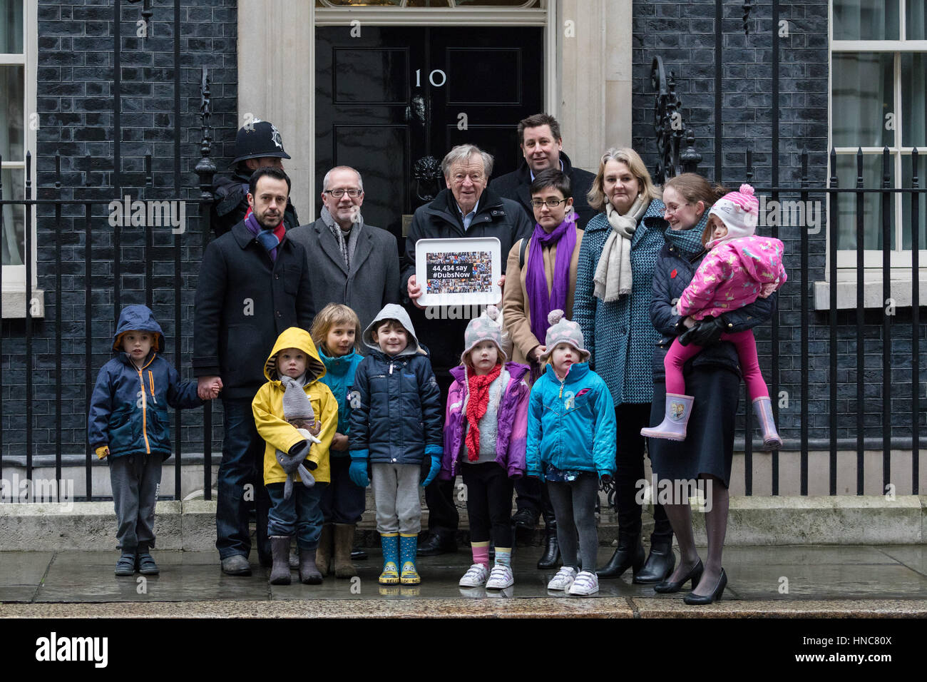 London, UK. 11th Feb 2017. Lord Alf Dubs and supporters, with their children, deliver a 44,435 strong petition to 10 Downing Street, calling on the Prime Minister, Theresa May to reconsider the ending of the Dubs Amendment scheme that allows unaccompanied child refugee migrants a safe passage into the UK. Lord Dubs arrived in the UK himself as a child refugee, along with nearly 10,000 predominantly Jewish children who were fleeing Nazi controlled Europe. Credit: Vickie Flores/Alamy Live News Stock Photo