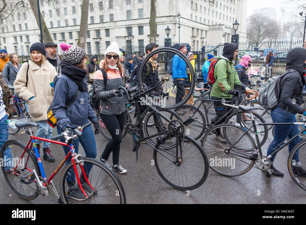London, UK. 11th February 2017.  As air pollution kills thousands every year, hundreds of cyclists set out from Trafalgar Square to stage a 'Dye-In' protest outside The Treasury demanding that the Chancellor increase funding for cycling, rising to 10% of the UK transport budget by 2020. Credit: Steve Parkins/Alamy Live News Stock Photo