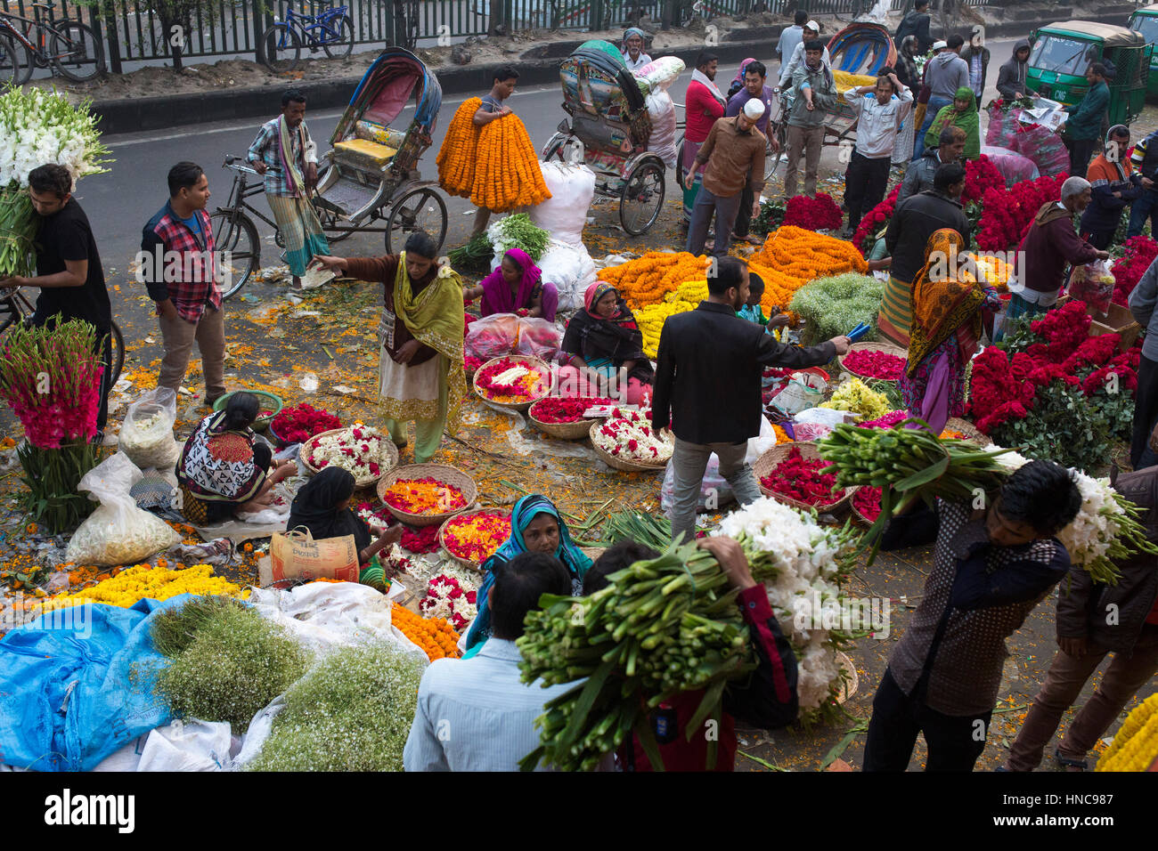 Dhaka, Bangladesh. 11th February 2017.People are busy with trade of flower in Shahbag flower market in Dhaka, Bangladesh on February 11, 2017. Thousand of people come this market at early morning to buy flowers as vendors bring their bloom from the southern region of the country.  Shahbag is famous for the flower market. It is the largest flower market of Bangladesh. Here flower are sell in whole-sell and retail price.These flowers are come from different districs in Bangladesh. Credit: zakir hossain chowdhury zakir/Alamy Live News Stock Photo