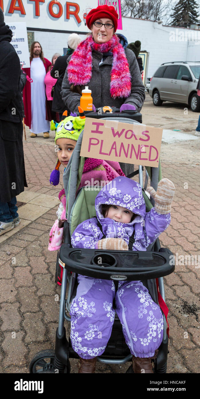 Ferndale, Michigan, USA. 11th February 2017. Supporters of Planned Parenthood far outnumbered opponents as both sides rallied outside Planned Parenthood clinics in metro Detroit. The Trump administration says it will deny federal funds to Planned Parenthood for women's health services because the agency helps some women obtain legal abortions. Credit: Jim West/Alamy Live News Stock Photo