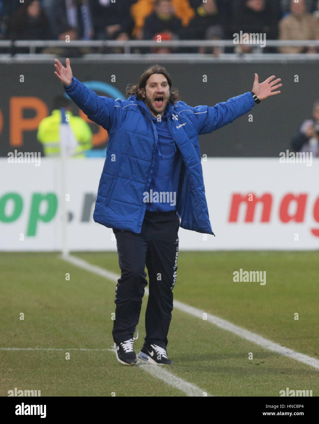 Darmstadt, Germany. 11th Feb, 2017. Darmstadt's coach Torsten Frings celebrates the 2:1 win after the final whistle of the German Bundesliga soccer match between Darmstadt 98 and Borussia Dortmund at the Jonathan Heimes stadium in Darmstadt, Germany, 11 February 2017. Photo: Frank Rumpenhorst/dpa/Alamy Live News Stock Photo