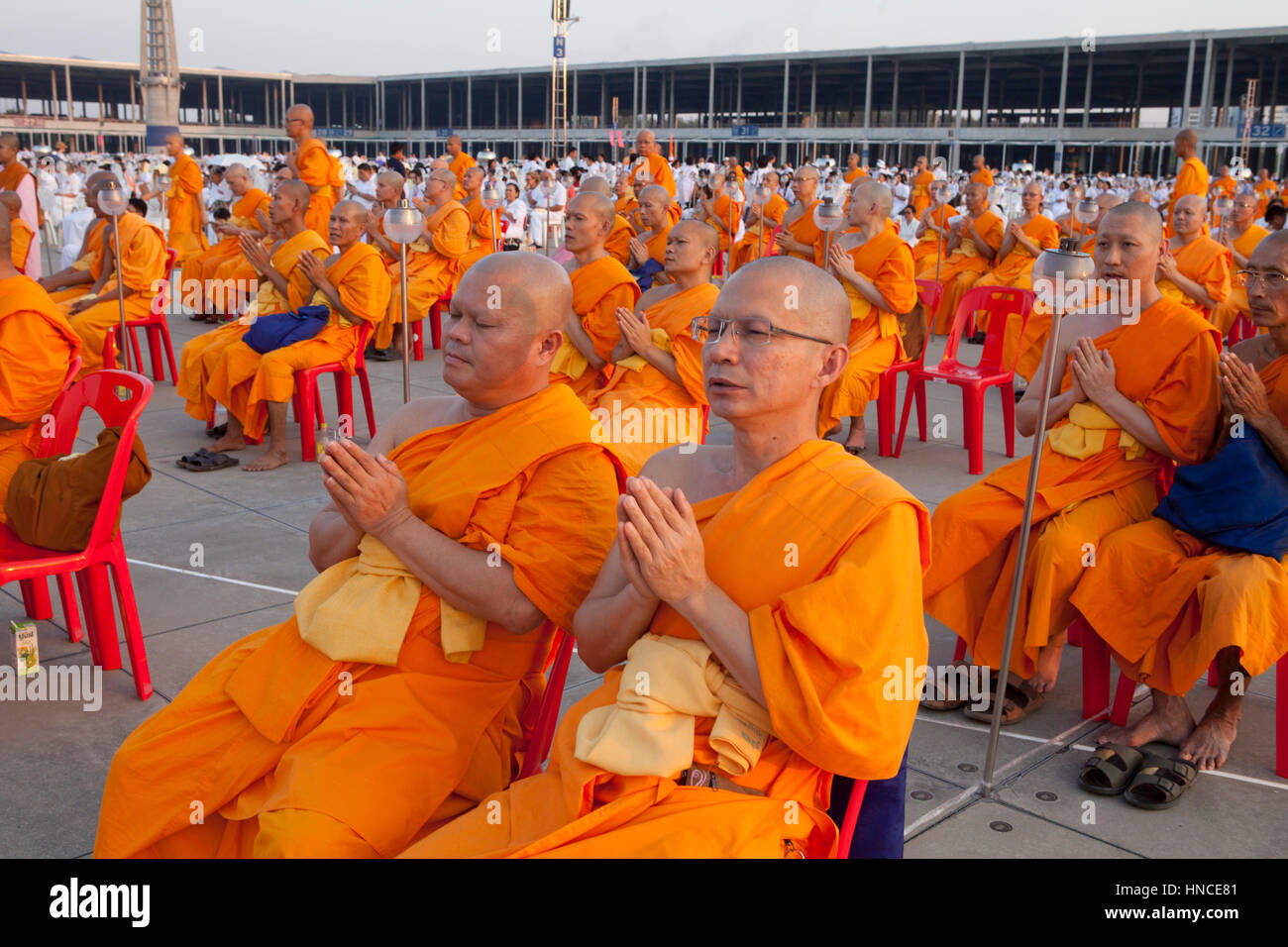 Bangkok, Thailand. 11th Feb, 2017. Thousands of Buddhist devotees and monks take part in evening prayers to mark Makha Bucha Day at Wat Dhammakaya temple, just north of Bangkok.  Makha Bucha Day is held in celebration of the teachings of the Lord Buddha. Credit: PixelPro/Alamy Live News Stock Photo