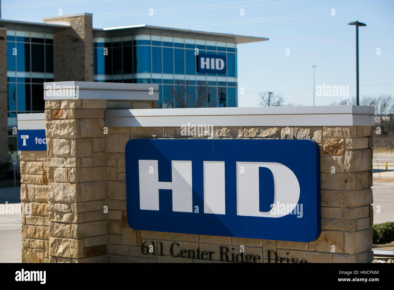 A logo sign outside of the headquarters of HID Global in Austin, Texas