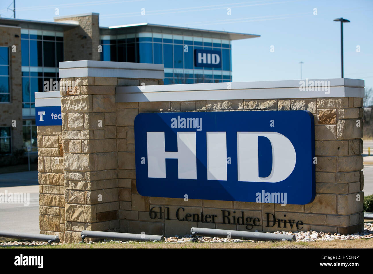 A logo sign outside of the headquarters of HID Global in Austin, Texas