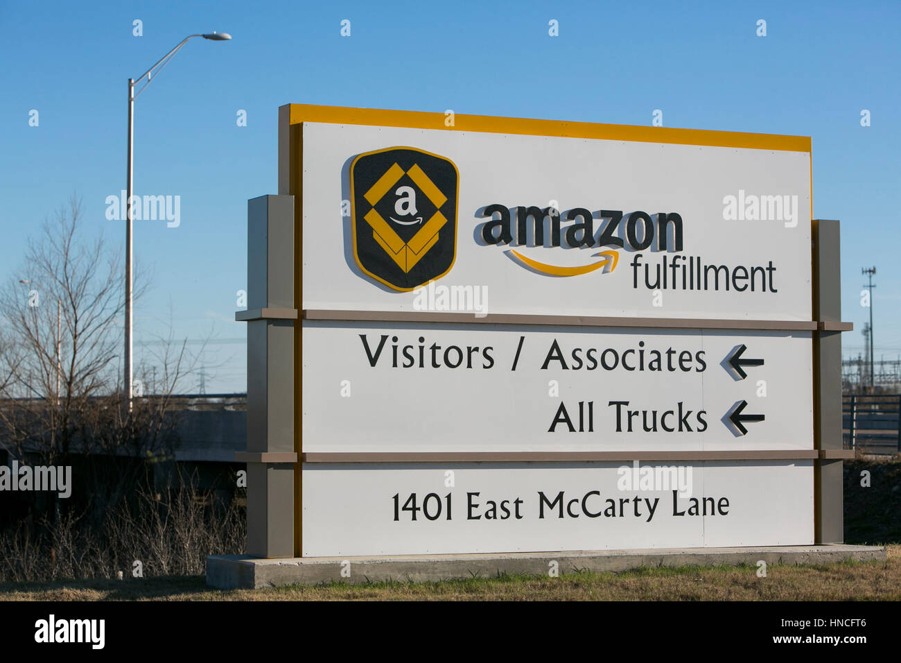 A logo sign outside of a Amazon Fulfillment center in San Marcos, Texas on January 28, 2017. Stock Photo