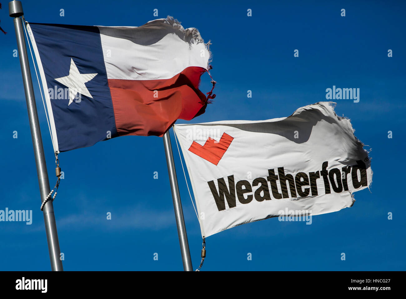 A logo sign outside of a facility occupied by Weatherford in Elmendorf