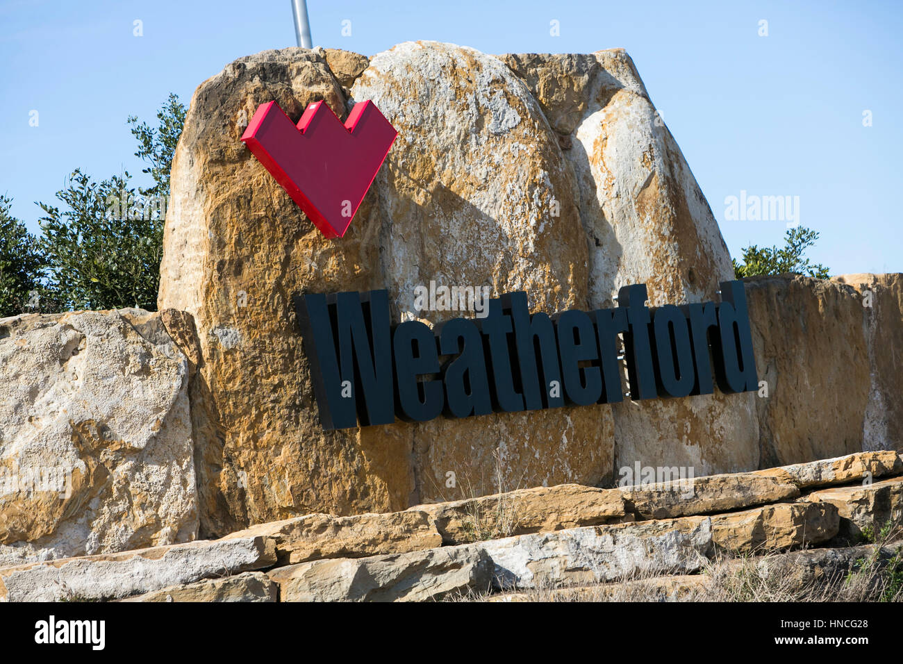 A logo sign outside of a facility occupied by Weatherford in Elmendorf