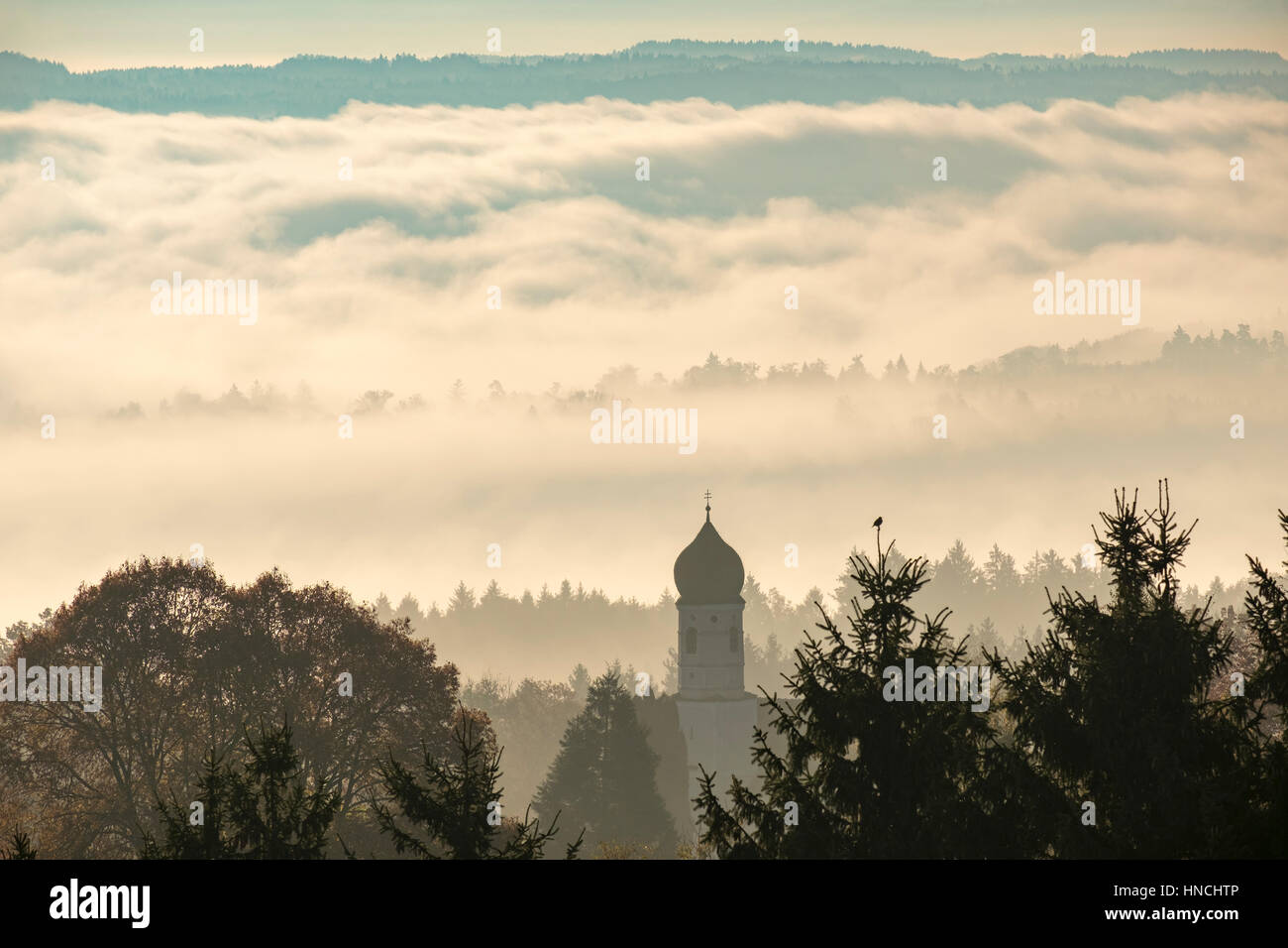 View from Ilkahöhe, Church of St. Nicholas in front of clouds, Tutzing, Fünfseenland, Upper Bavaria, Bavaria, Germany Stock Photo