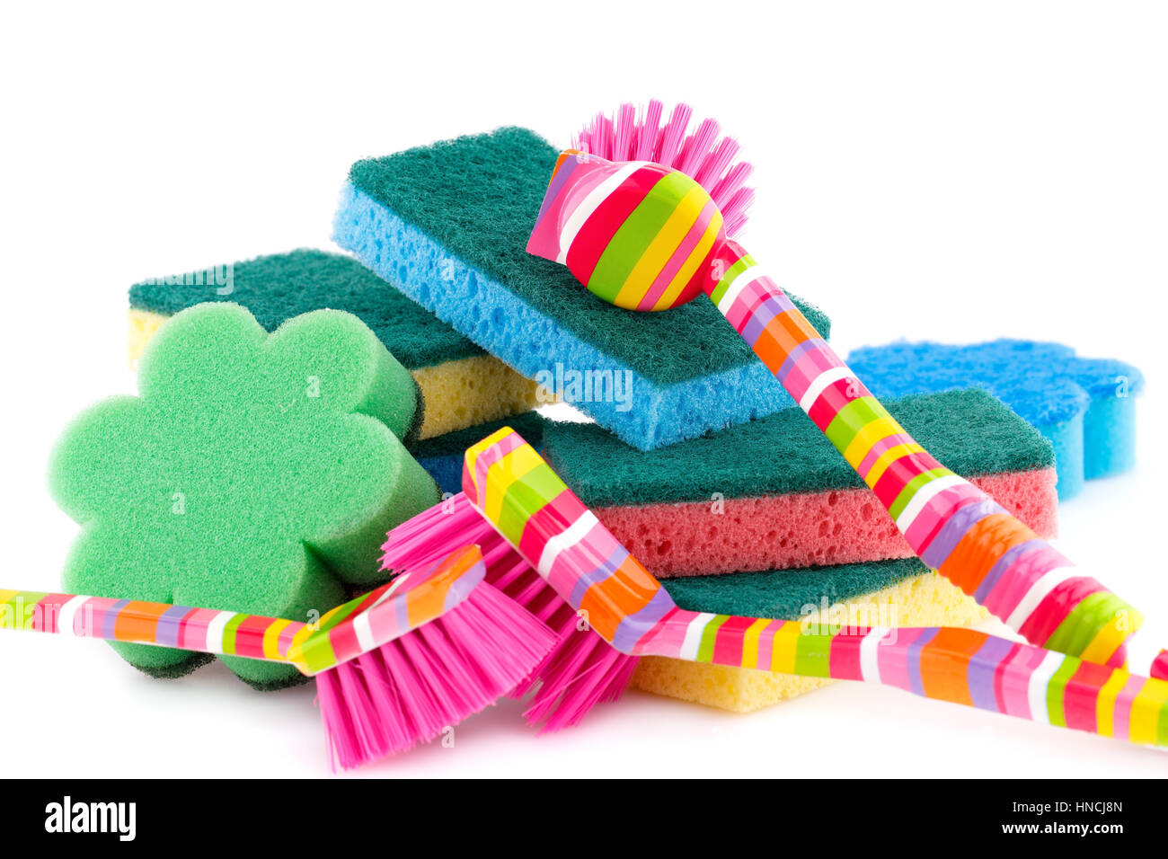Colorful sponges and brushes isolated on white background. Stock Photo