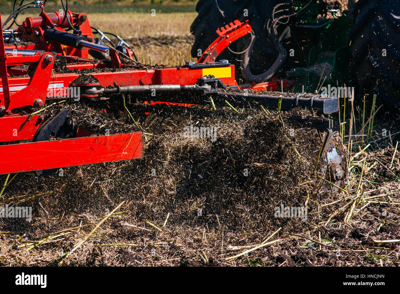 Tractor plowing up the field Stock Photo Alamy