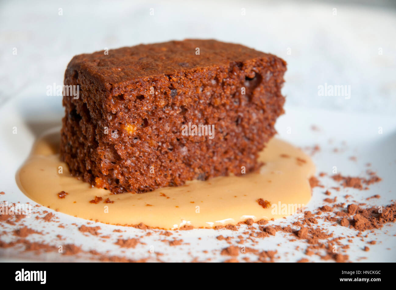 Chocolate cake with toffee sauce. Close view Stock Photo Alamy