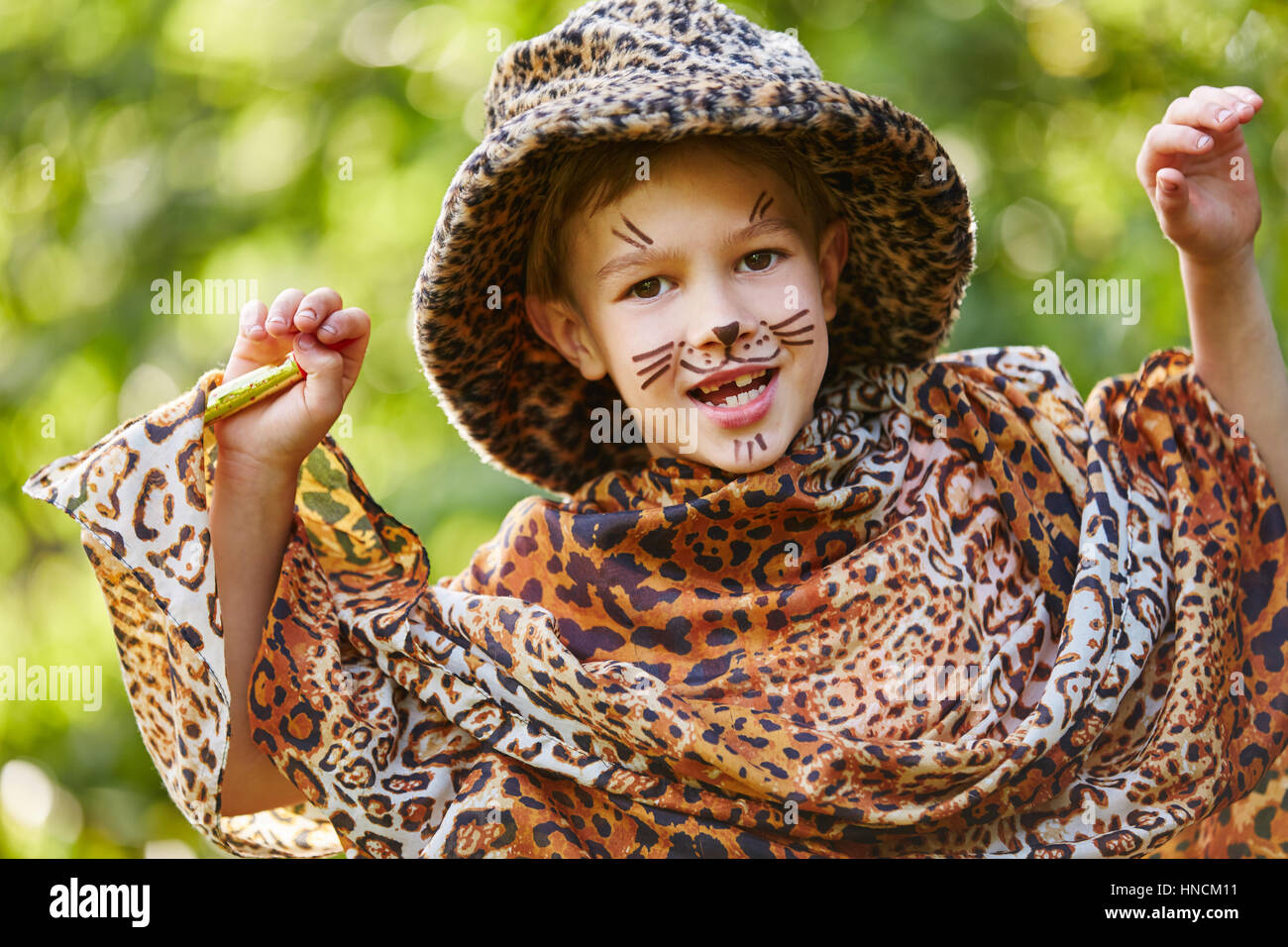 Boy having fun in children's theater dressed up like leopard Stock Photo