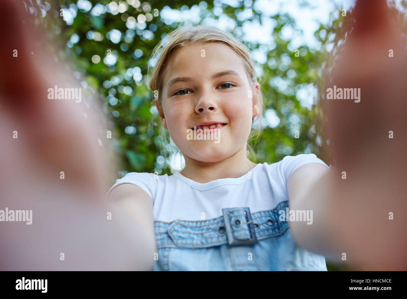 Portrait of girl in summer in the park playing Stock Photo