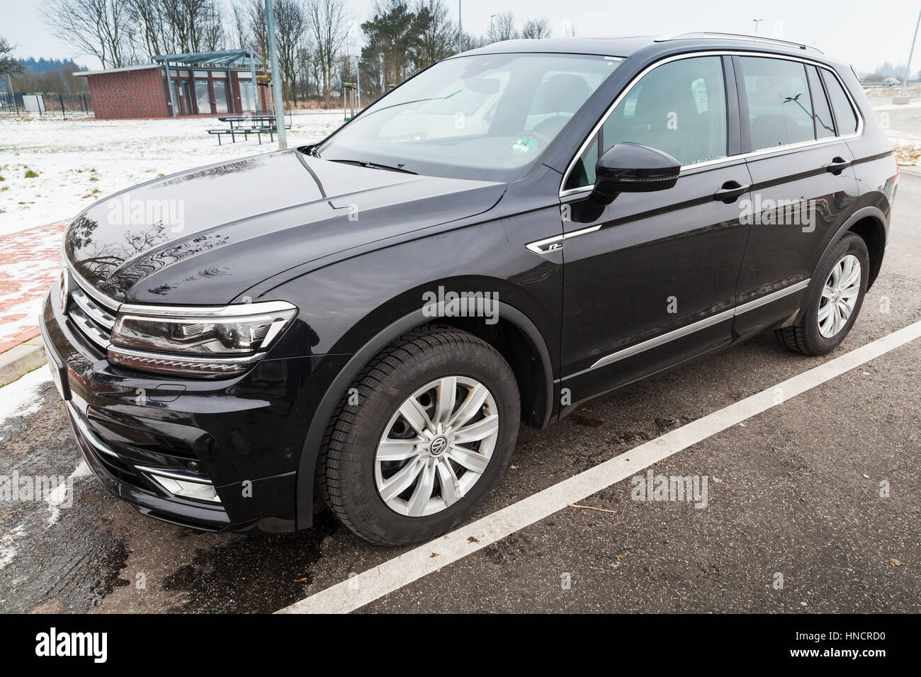 Hamburg, Germany - February 10, 2017: Outdoor photo of second generation Volkswagen Tiguan, R-Line. Black compact crossover vehicle CUV manufactured b Stock Photo
