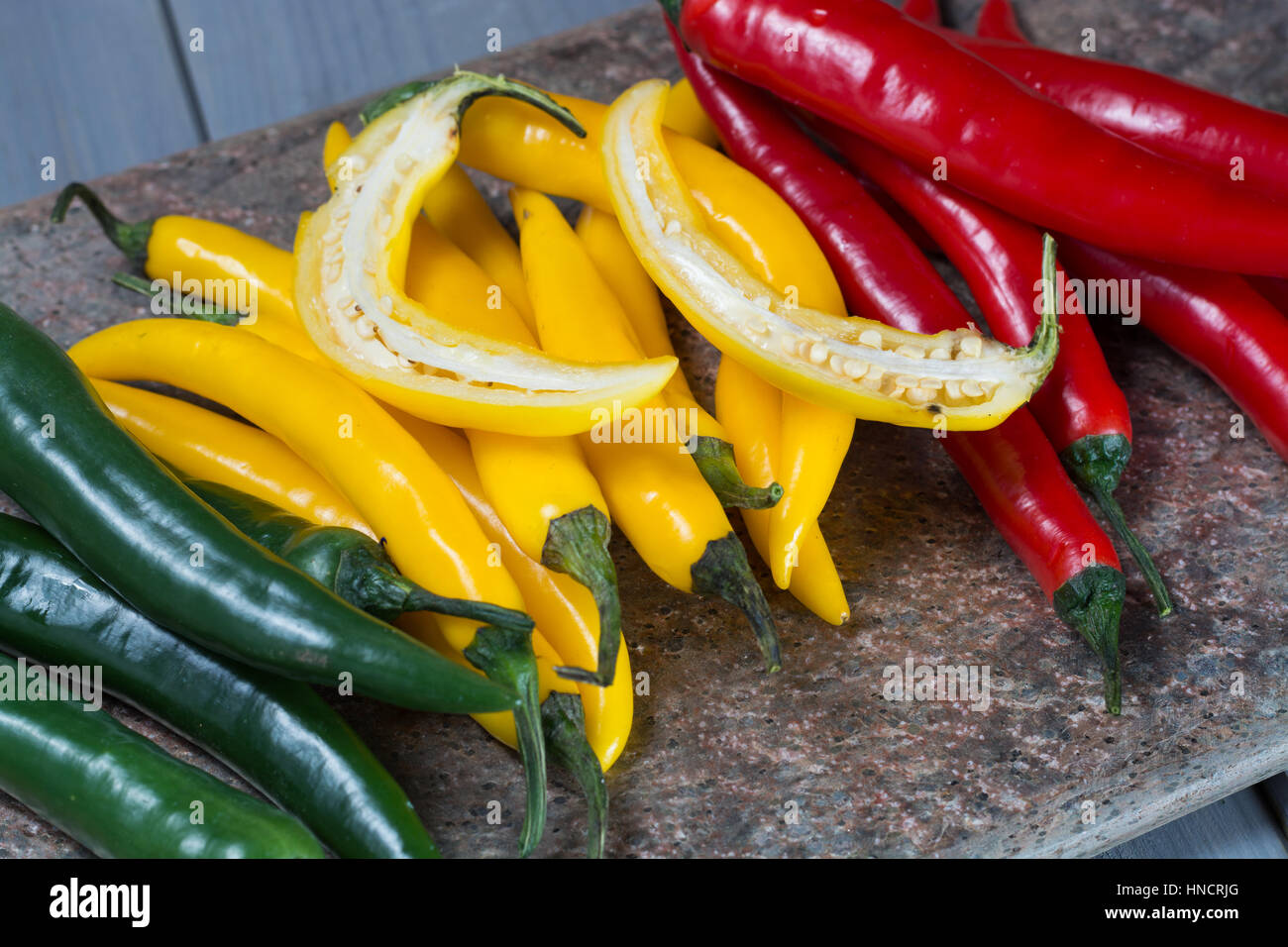 Yellow, red and green mexican hot chili peppers top view Stock Photo ...