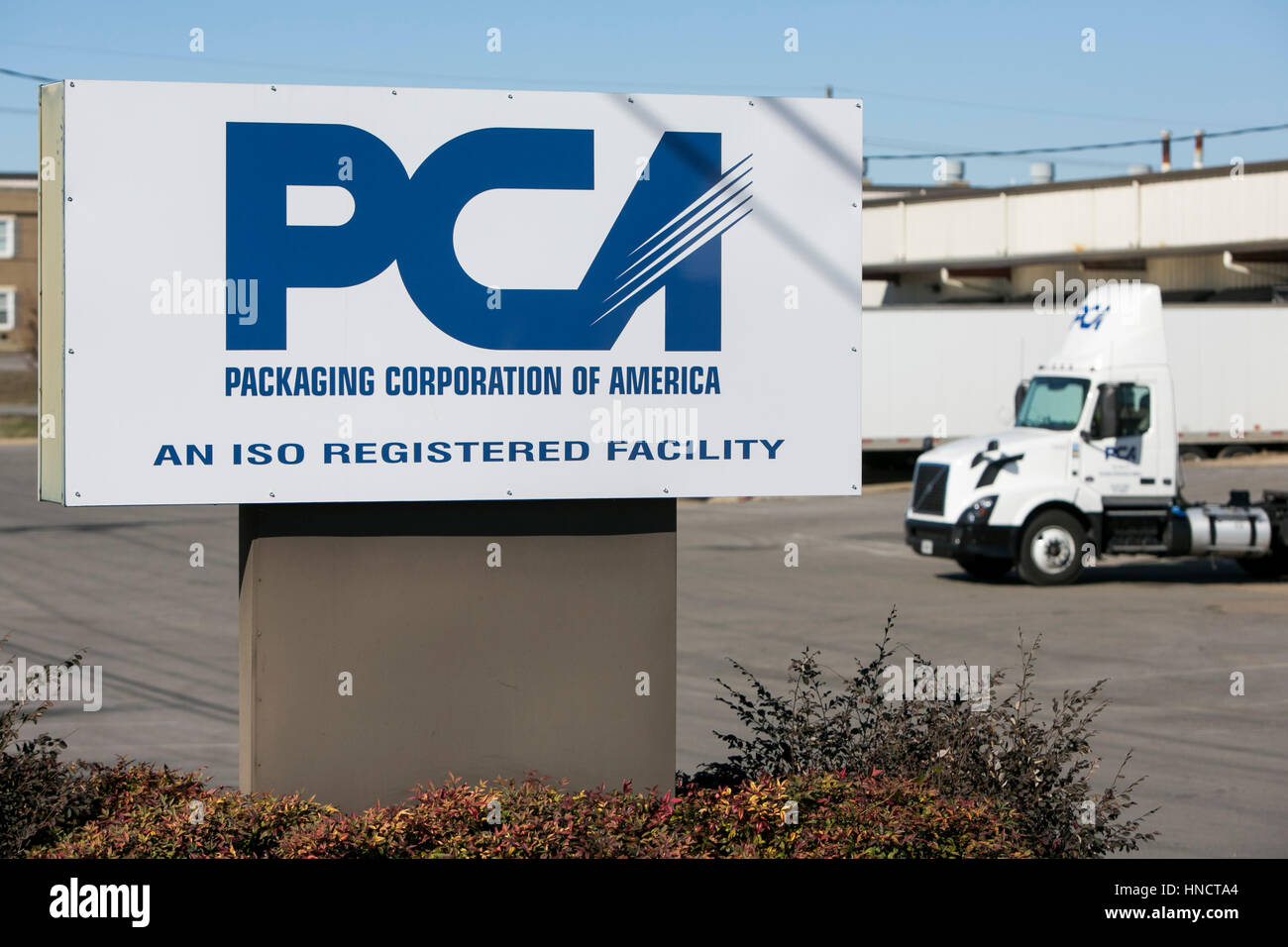 A logo sign outside of a facility occupied by Packaging Corporation of America (PCA) in Gallatin