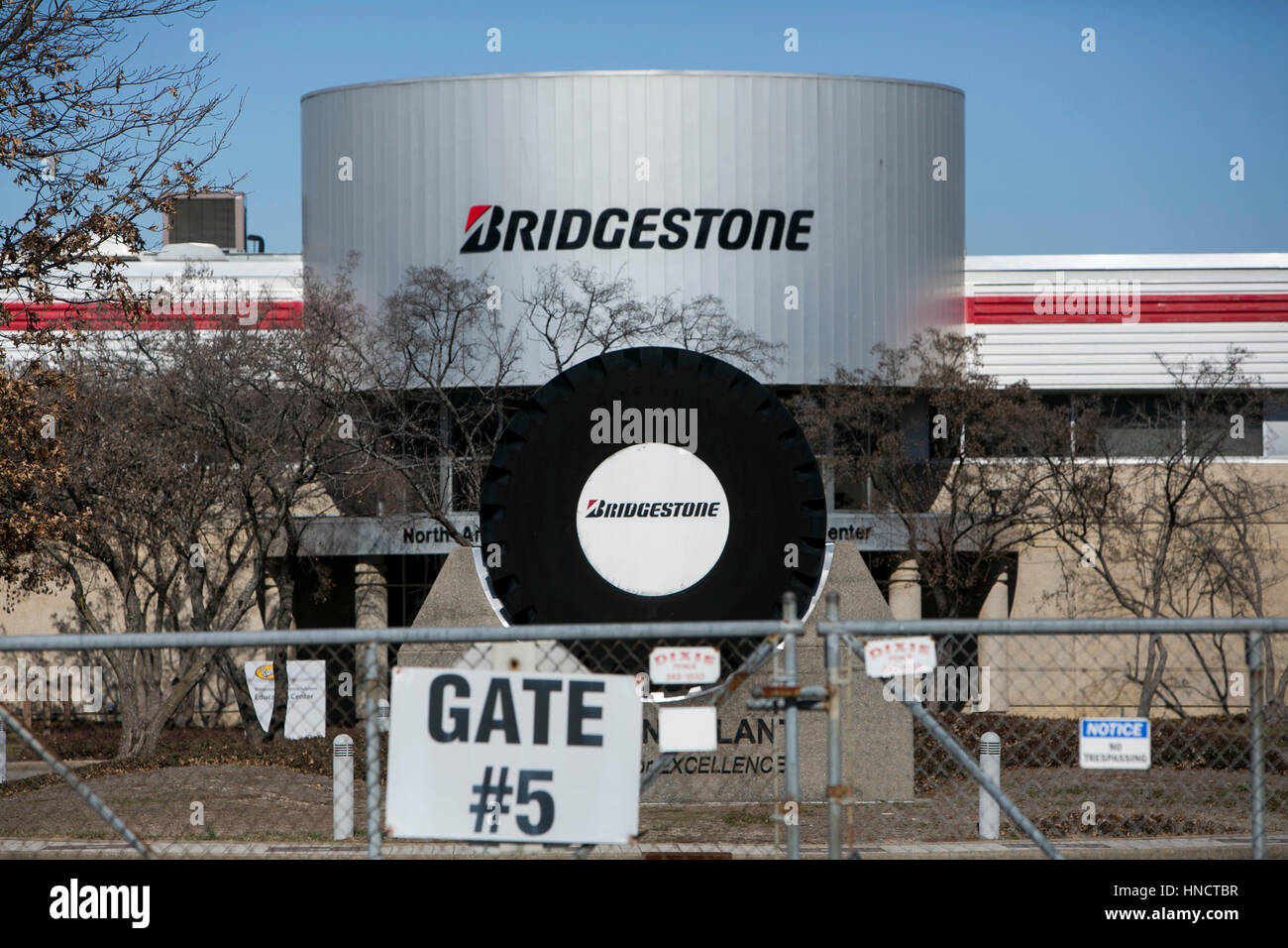 A logo sign outside of a facility occupied by the Bridgestone