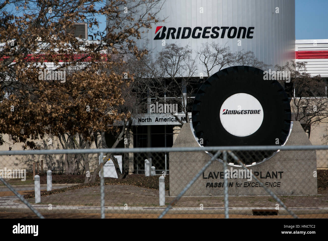 A logo sign outside of a facility occupied by the Bridgestone