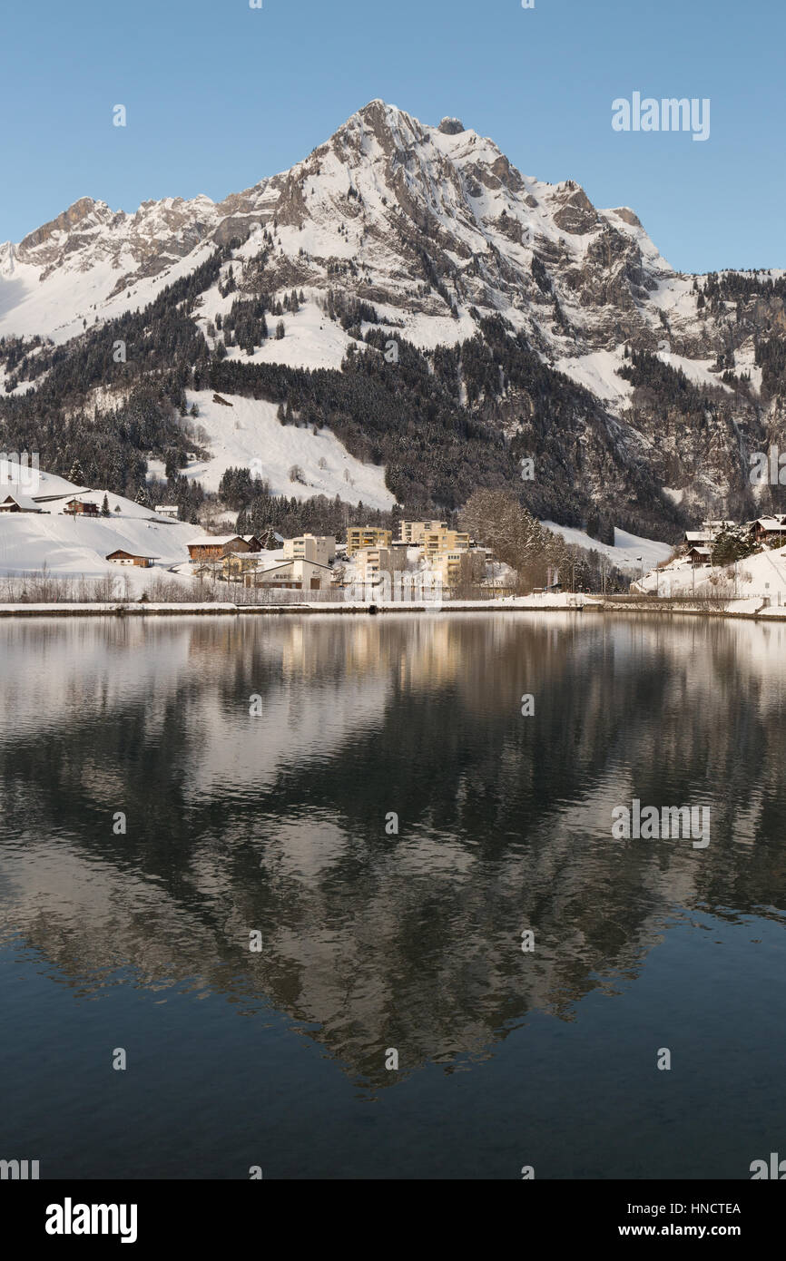 A photograph of lake Eugenisee at Engelberg in the canton of Obwalden, Switzerland. In winter it is surrounded with snow capped mountains. Stock Photo