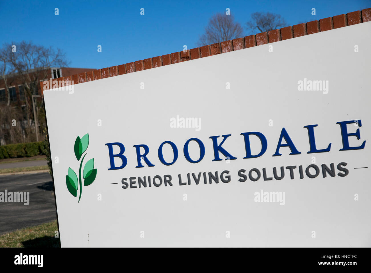 A logo sign outside of the headquarters of Brookdale Senior Living in