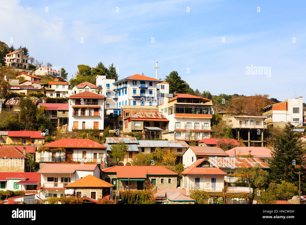 Village houses cling to the hillside, Pedoulas, Cyprus Stock Photo