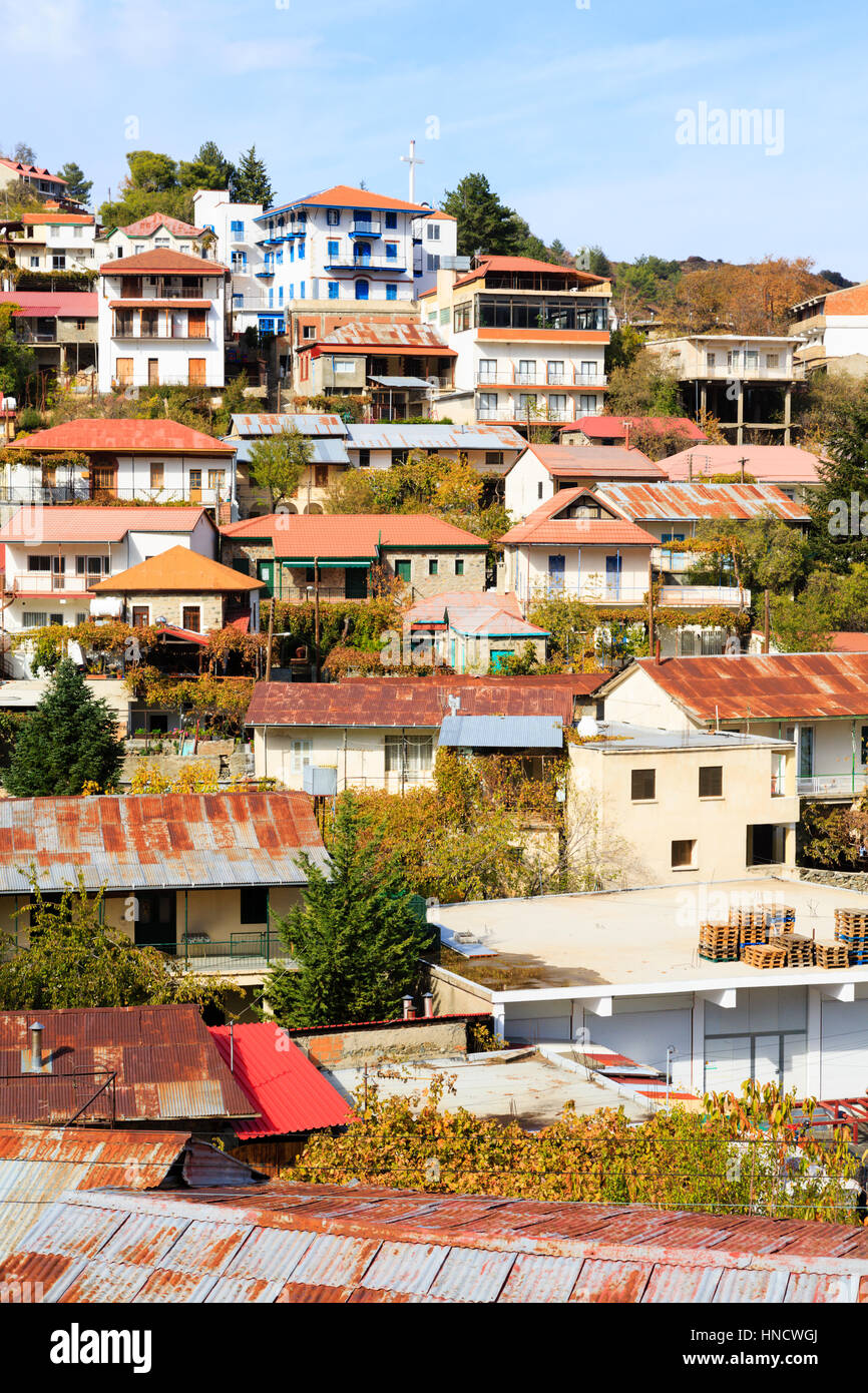 Village houses cling to the hillside, Pedoulas, Cyprus Stock Photo