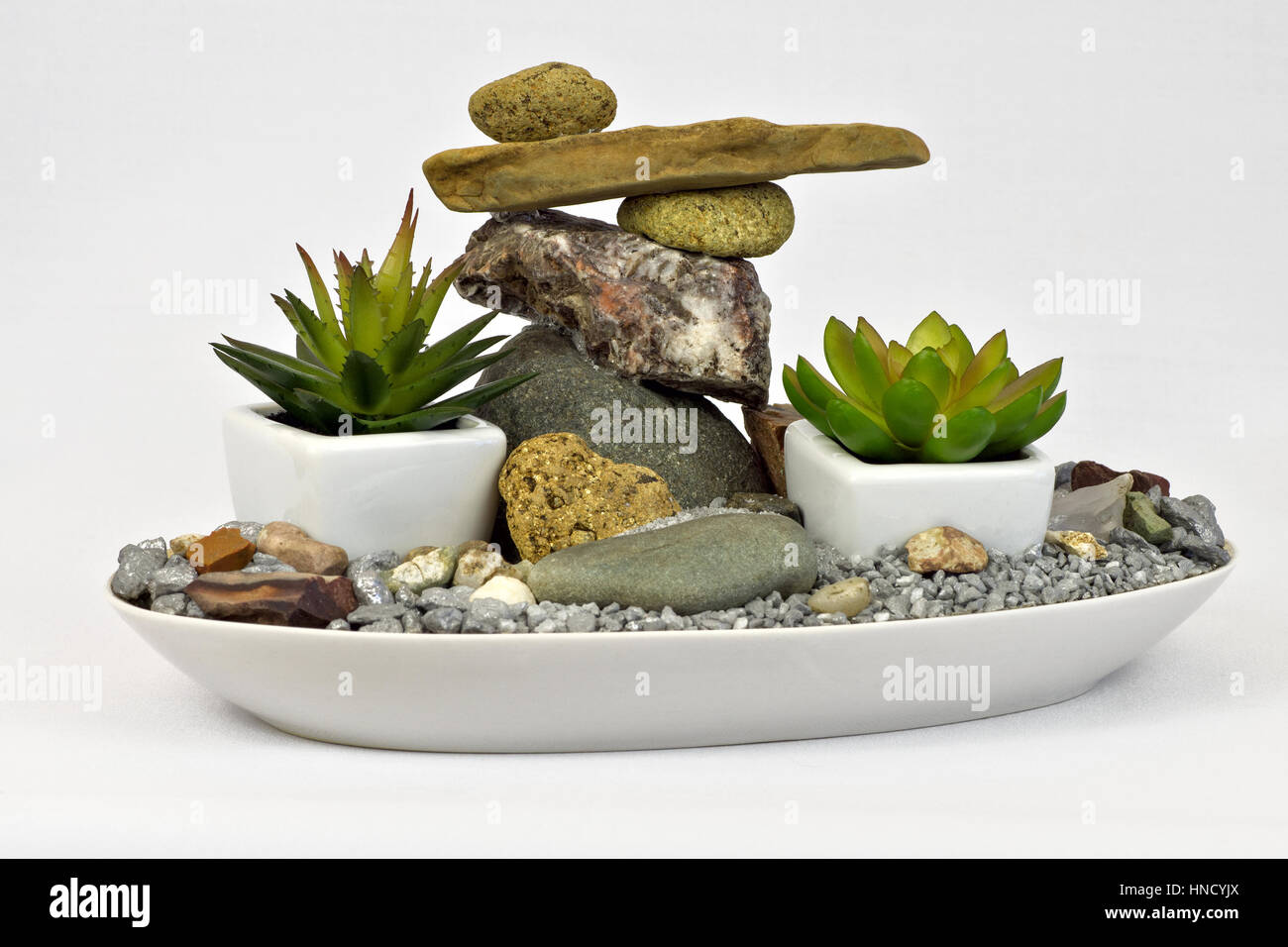 Mini-garden with balanced stones Stock Photo