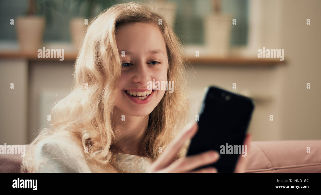 Happy girl takes selfie portrait. Using smartphone concept Stock Photo ...