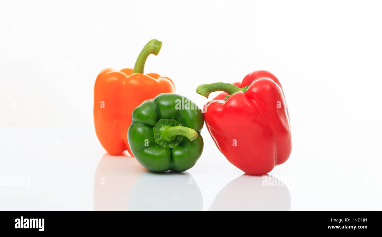 Colorful bell peppers isolated on white background Stock Photo - Alamy