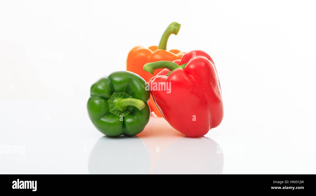 Colorful bell peppers isolated on white background Stock Photo - Alamy