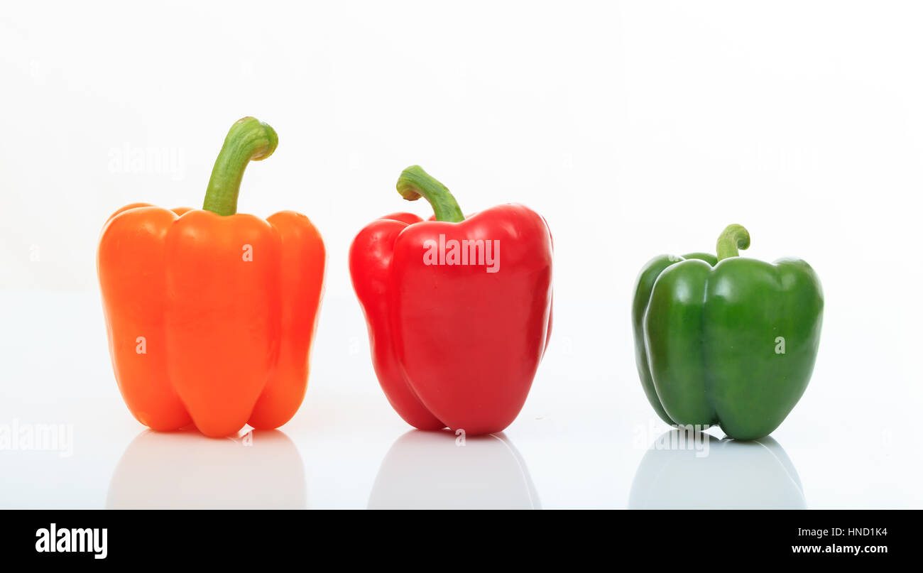 Colorful bell peppers isolated on white background Stock Photo - Alamy