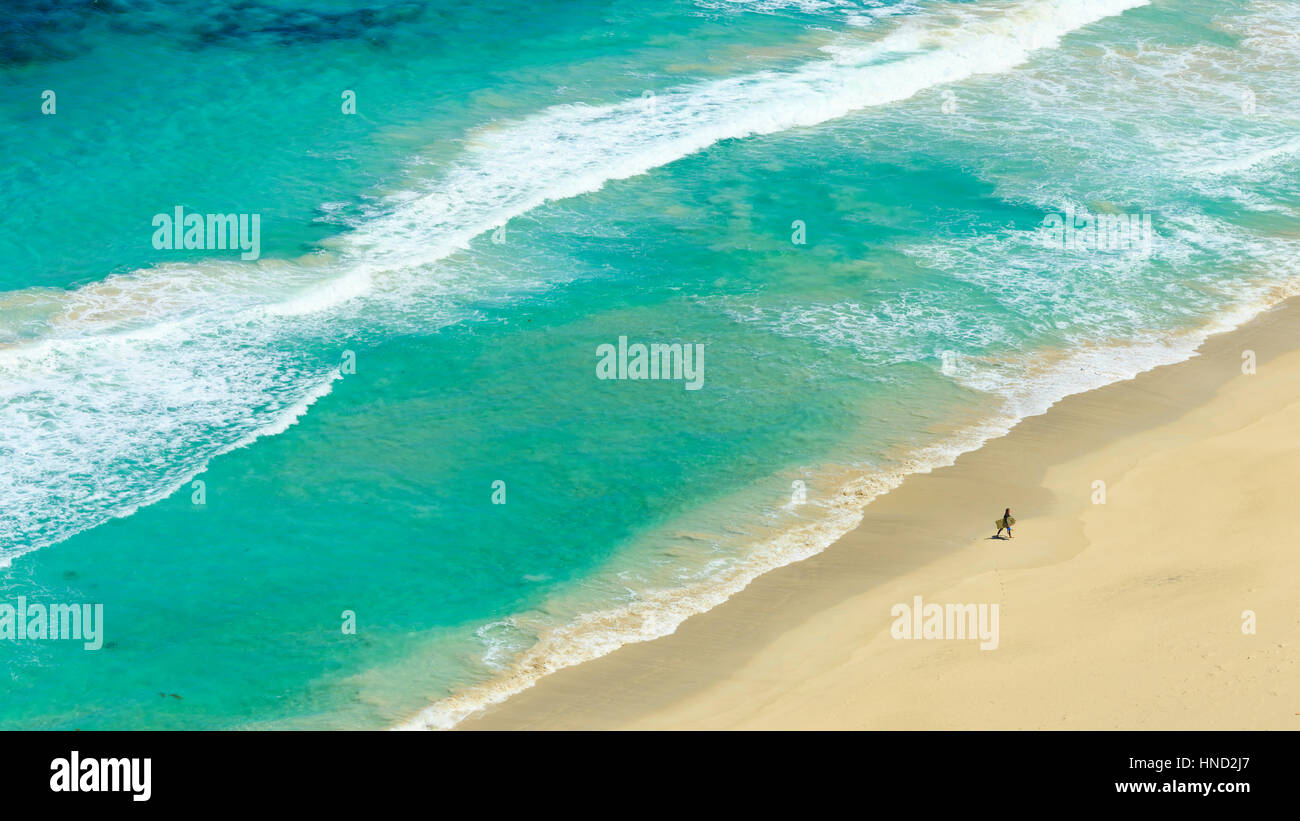 Surfer Returning To Shore Stock Photo