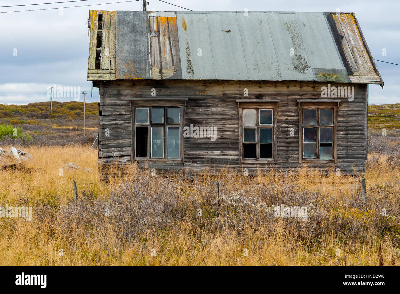 Old wooden decrepit house in need of repair with damaged roof and ...