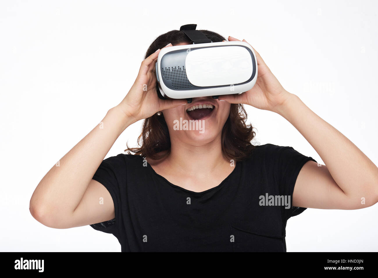 Surprised woman watching virtual reality movie isolated on white