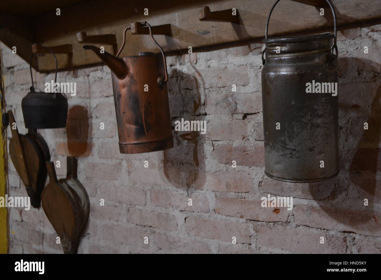 Antique household items hung on the wall Stock Photo