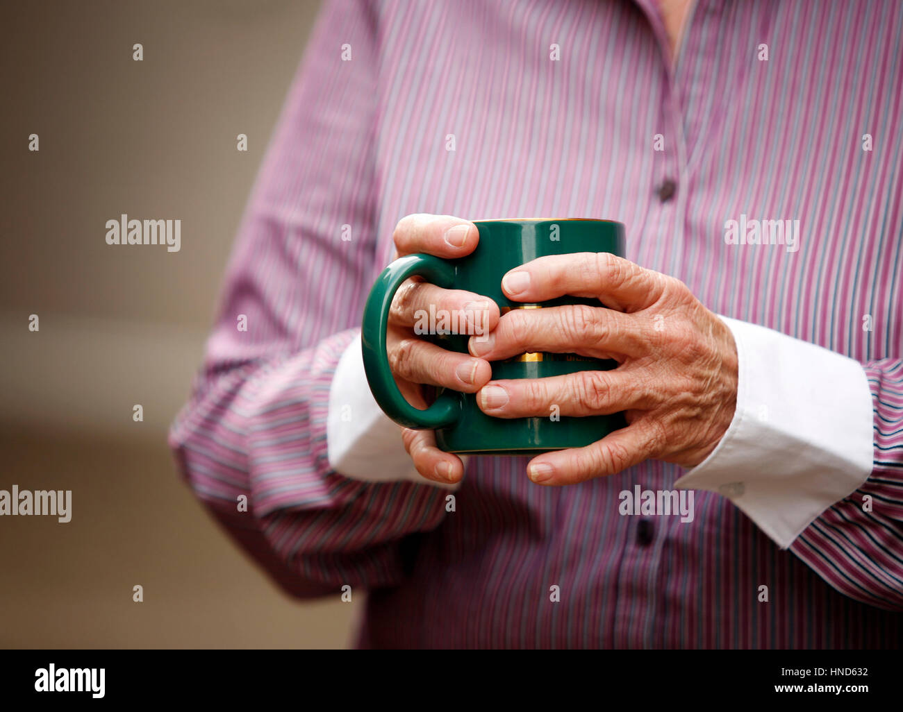 Hands of elderly woman with arthritis holding cup Stock Photo Alamy