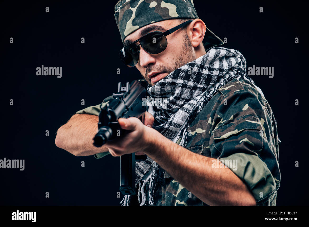 Terrorist sniper shooting with his weapon. Concept about terrorism Stock Photo