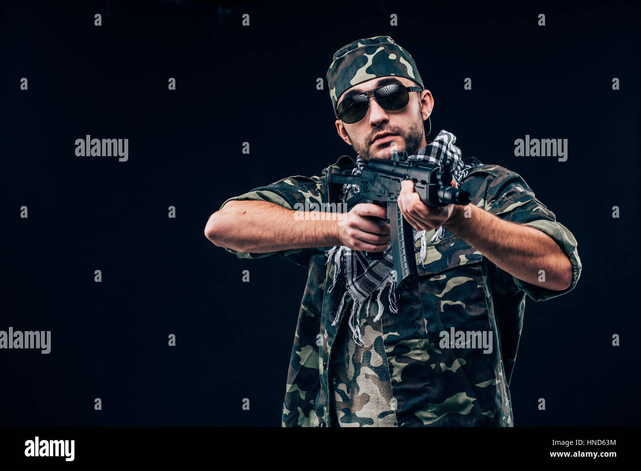 Terrorist sniper shooting with his weapon. Concept about terrorism Stock Photo