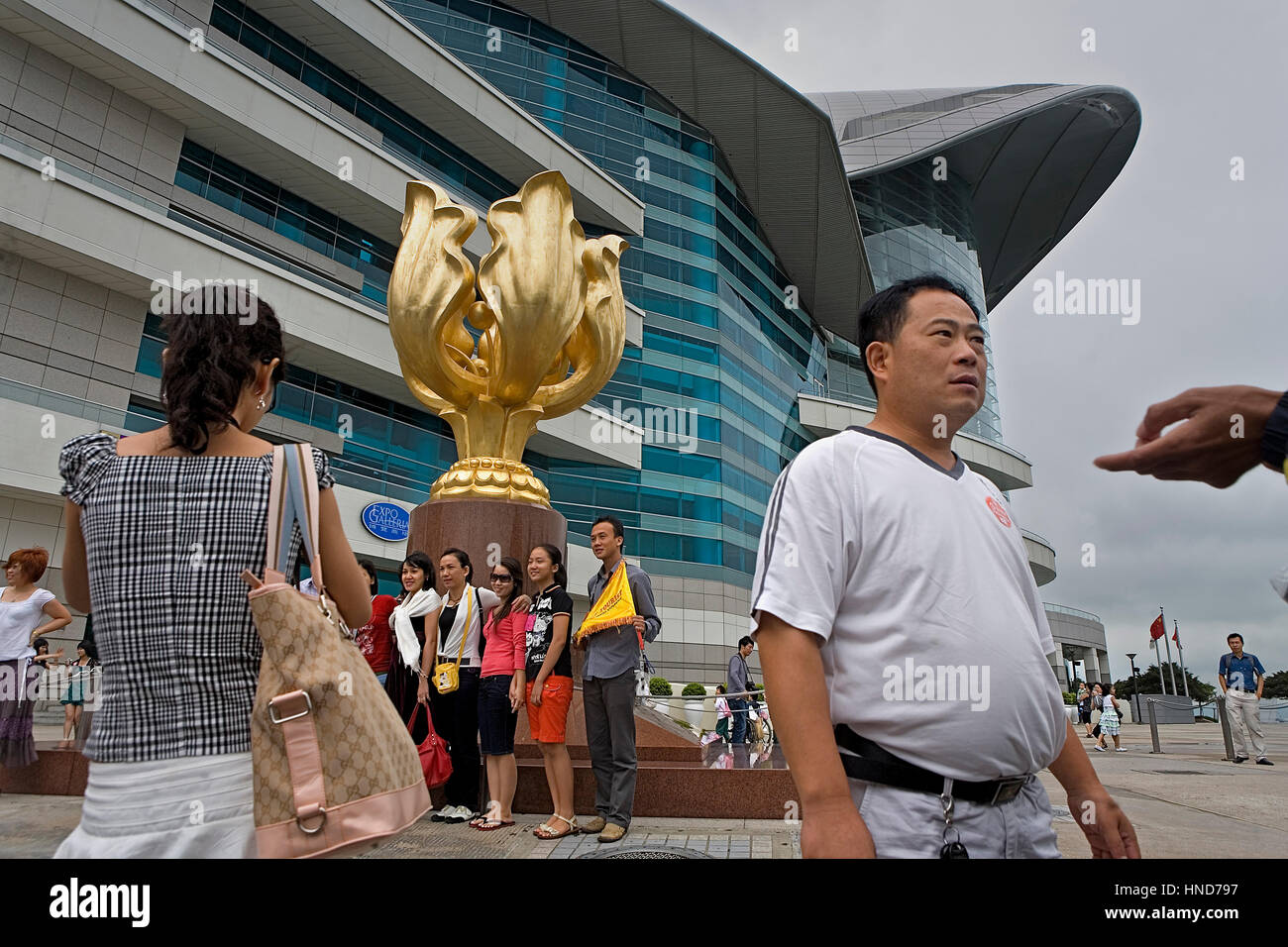 Bauhinia sculpture built to Commemorate the return of Hong Kong to China, in background the Convention and Exhibition Center,Hong Kong, China Stock Photo